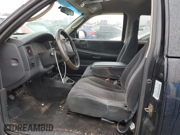 2001 Dodge Dakota Sport z VIN 1B7GL22N31S137577, wystawiony jako Copart lot #50119405 z przebiegiem Nie podano mil oraz Czysty tytuł • Clean title. Historia ofert i sprzedaży dostępna na DreamBid. Obrazek 7.