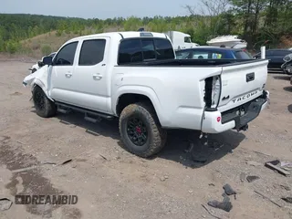 2021 Toyota Tacoma 4WD SR with VIN 3TMCZ5AN2MM414975, listed as a IAAI auction lot 41997227 with 57,729 mi miles. Bid and sale history available at carsss.com. Image 3.