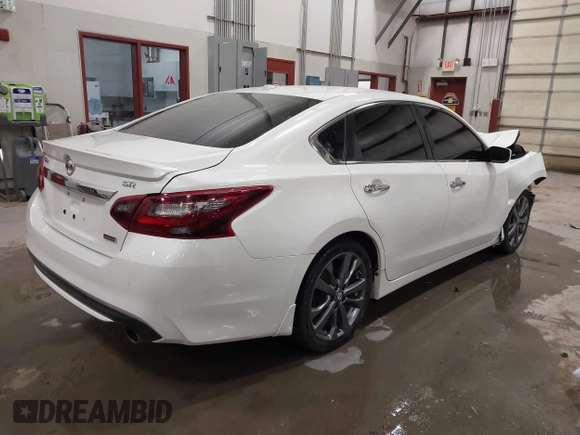 2018 Nissan Altima SV with VIN 1N4AL3AP9JC271718, listed as a IAAI auction lot 41787242 with 73,523 mi miles and . Bid and sale history available at carsss.com. Image 4.