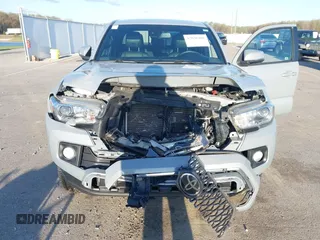2018 Toyota Tacoma SR5 with VIN 3TMDZ5BN3JM054548, listed as a IAAI auction lot 42038480 with 122,242 mi miles and . Bid and sale history available at DreamBid. Image 6.