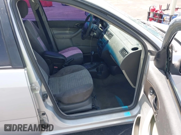 2007 Ford Focus S z VIN 1FAHP34NX7W163158, wystawiony jako IAAI lot #42586421 z przebiegiem 123 131 mil mil oraz . Historia ofert i sprzedaży dostępna na DreamBid. Obrazek 5.