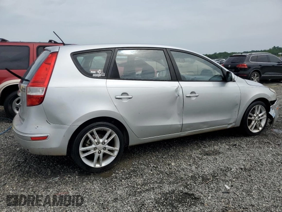 2009 Hyundai Elantra Touring z VIN KMHDC86E29U038194, wystawiony jako Copart lot #57483375 z przebiegiem 218 337 mil mil oraz Szkoda całkowita • Salvage title. Historia ofert i sprzedaży dostępna na DreamBid. Obrazek 3.