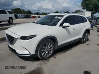 2021 Mazda CX-9 Grand Touring z VIN JM3TCADY7M0501717, wystawiony jako Copart lot #59402875 z przebiegiem 53 218 mil mil oraz Szkoda całkowita • Salvage title. Historia ofert i sprzedaży dostępna na DreamBid. Obrazek 1.