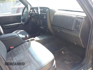2001 Jeep Cherokee Sport z VIN 1J4FF48S71L572604, wystawiony jako IAAI lot #42817599 z przebiegiem 212 774 mil mil oraz . Historia ofert i sprzedaży dostępna na DreamBid. Obrazek 5.