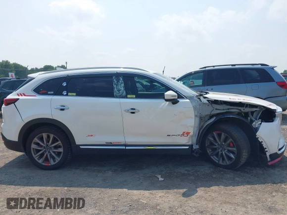 2020 Mazda CX-9 Grand Touring with VIN JM3TCBDY3L0410674, listed as a IAAI auction lot 42389157 with 130,519 mi miles and . Bid and sale history available at DreamBid. Image 13.