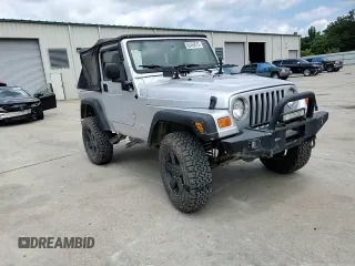 2005 Jeep Wrangler X with VIN 1J4FA39S55P353789, listed as a Copart auction lot 62469015 with 143,817 mi miles and Salvage title. Bid and sale history available at DreamBid. Image 13.