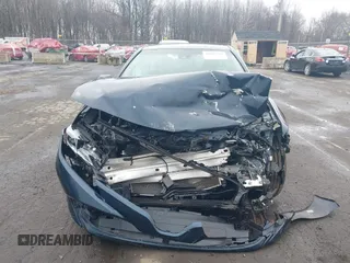 2020 Toyota Camry LE with VIN 4T1L11AK3LU977805, listed as a IAAI auction lot 41907558 with 82,237 mi miles and . Bid and sale history available at DreamBid. Image 13.