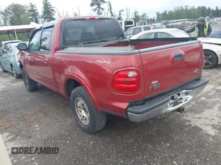 2001 Ford F-150 XLT with VIN 1FTRW08L91KE59120, listed as a IAAI auction lot 42301677 with Not provided miles and . Bid and sale history available at DreamBid. Image 3.