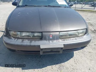 1998 Saturn SL z VIN 1G8ZJ5276WZ291081, wystawiony jako IAAI lot #42632567 z przebiegiem 238 130 mil mil oraz . Historia ofert i sprzedaży dostępna na DreamBid. Obrazek 6.