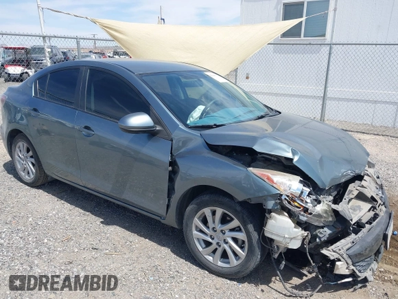 2012 Mazda Mazda3 i Touring with VIN JM1BL1V83C1625799, listed as a IAAI auction lot 42046912 with 227,680 mi miles. Bid and sale history available at carsss.com. Image 1.