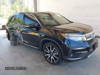 2021 Honda Pilot Touring 8-Passenger z VIN 5FNYF6H99MB049728, wystawiony jako IAAI lot #42194602 z przebiegiem 41 374 mil mil oraz . Historia ofert i sprzedaży dostępna na DreamBid. Obrazek 1.