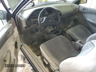 1996 Ford Escort z VIN 1FASP11J0TW123967, wystawiony jako Copart lot #52859835 z przebiegiem 164 693 mil mil oraz Szkoda całkowita • Salvage title. Historia ofert i sprzedaży dostępna na DreamBid. Obrazek 8.