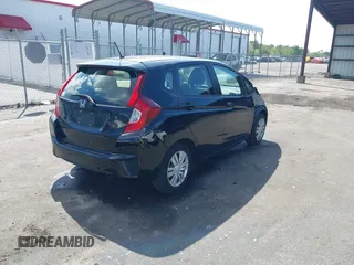 2016 Honda Fit LX with VIN JHMGK5H57GS010902, listed as a IAAI auction lot 41902395 with 124,531 mi miles. Bid and sale history available at carsss.com. Image 4.