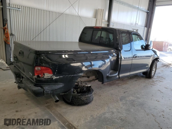 2002 Ford F-150 XL with VIN 2FTRX07W72CA71544, listed as a Copart auction lot 81628694 with 313,663 mi miles and Salvage title. Bid and sale history available at DreamBid. Image 3.