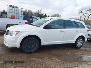 2014 Dodge Journey American Value with VIN 3C4PDCAB1ET209973, listed as a IAAI auction lot 41803864 with 168,774 mi miles and . Bid and sale history available at DreamBid. Image 14.