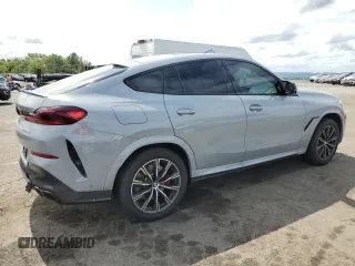 2025 BMW X6 M60i with VIN 5UX43EX06S9W68023, listed as a Copart auction lot 69874764 with 3,789 mi miles and Salvage Title. Bid and sale history available at carsss.com. Image 3.