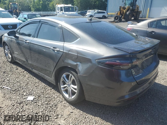 2016 Ford Fusion SE Hybrid z VIN 3FA6P0LU3GR173886, wystawiony jako Copart lot #60066015 z przebiegiem 140 328 mil mil oraz Szkoda całkowita • Salvage title. Historia ofert i sprzedaży dostępna na DreamBid. Obrazek 2.
