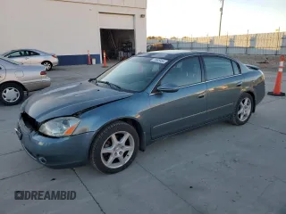 2002 Nissan Altima SE with VIN 1N4BL11E72C201174, listed as a Copart auction lot 79895454 with 164,506 mi miles and Salvage Title. Bid and sale history available at carsss.com. Image 1.