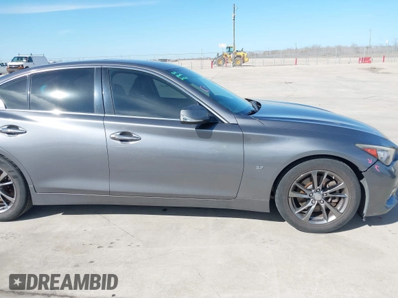 2015 Infiniti Q50 Premium with VIN JN1BV7AP0FM355933, listed as a IAAI auction lot 41684066 with 116,230 mi miles and . Bid and sale history available at DreamBid. Image 14.