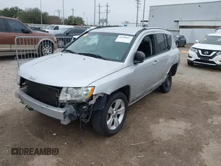 2011 Jeep Compass with VIN 1J4NT1FA7BD142600, listed as a IAAI auction lot 41590661 with 266,600 mi miles. Bid and sale history available at carsss.com. Image 19.