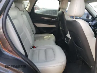 2018 Mazda CX-5 Grand Touring z VIN JM3KFBDM4J0300519, wystawiony jako Copart lot #51548745 z przebiegiem 102 853 mil mil oraz Szkoda całkowita • Salvage title. Historia ofert i sprzedaży dostępna na DreamBid. Obrazek 11.