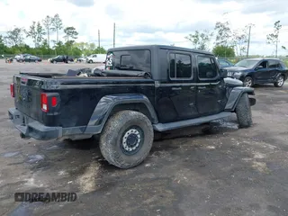 2021 Jeep Gladiator Sport S with VIN 1C6JJTAM3ML546307, listed as a IAAI auction lot 42635138 with Not provided miles and . Bid and sale history available at DreamBid. Image 4.