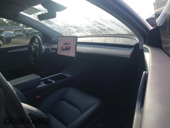 2023 Tesla Model Y Long Range with VIN 7SAYGDEE7PA196038, listed as a IAAI auction lot 41459601 with 16,489 mi miles and . Bid and sale history available at DreamBid. Image 5.