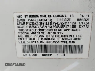 2011 Honda Pilot Touring with VIN 5FNYF4H97BB067954, listed as a IAAI auction lot 41832617 with 141,141 mi miles. Bid and sale history available at carsss.com. Image 9.