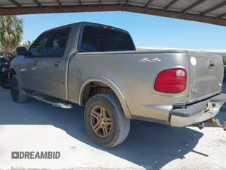 2002 Ford F-150 XLT with VIN 1FTRW08LX2KE43025, listed as a IAAI auction lot 42060641 with 123,507 mi miles. Bid and sale history available at carsss.com. Image 3.