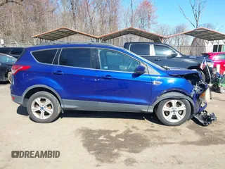 2013 Ford Escape SE with VIN 1FMCU9GX5DUB20394, listed as a IAAI auction lot 41889989 with 121,417 mi miles. Bid and sale history available at carsss.com. Image 12.