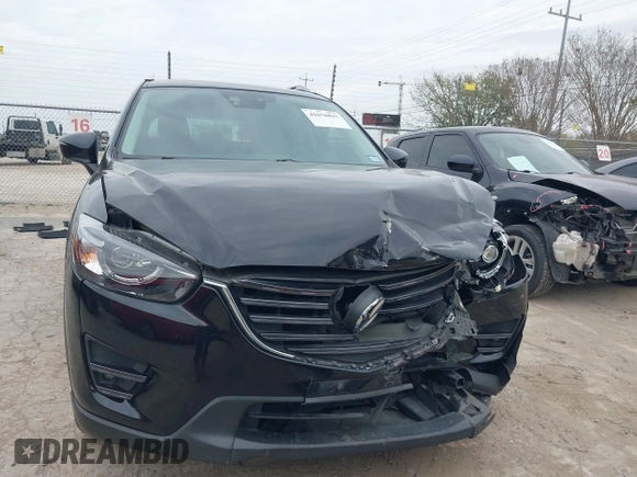 2016 Mazda CX-5 Grand Touring with VIN JM3KE2DY0G0651300, listed as a IAAI auction lot 41678833 with 98,790 mi miles. Bid and sale history available at carsss.com. Image 12.