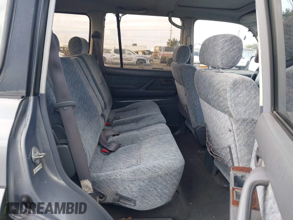 1995 Toyota Land Cruiser z VIN JT3DJ81W0S0094999, wystawiony jako IAAI lot #41583748 z przebiegiem 93 454 mil mil oraz . Historia ofert i sprzedaży dostępna na DreamBid. Obrazek 8.