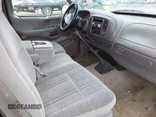 1997 Ford F-150 with VIN 2FTDX1720VCA73590, listed as a IAAI auction lot 41956713 with 128,220 mi miles and . Bid and sale history available at DreamBid. Image 5.