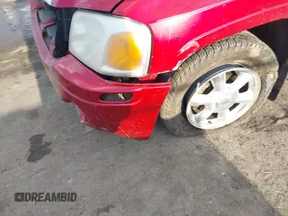 2005 GMC Envoy SLT z VIN 1GKET16M956158147, wystawiony jako IAAI lot #41683236 z przebiegiem Nie podano mil oraz . Historia ofert i sprzedaży dostępna na DreamBid. Obrazek 6.