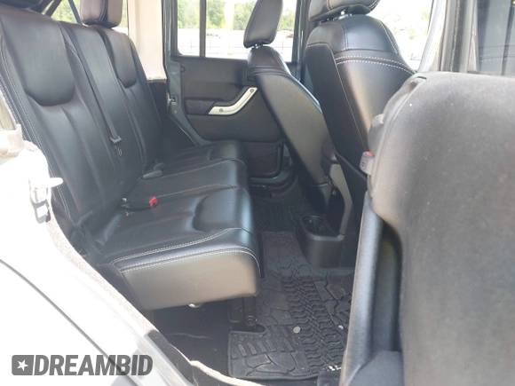 2014 Jeep Wrangler Unlimited Sahara with VIN 1C4BJWEG5EL326980, listed as a IAAI auction lot 42031659 with 116,181 mi miles and . Bid and sale history available at DreamBid. Image 8.