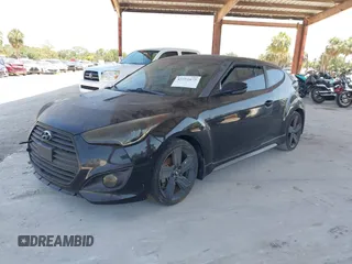 2014 Hyundai Veloster Turbo with VIN KMHTC6AE0EU210837, listed as a IAAI auction lot 42351675 with 91,523 mi miles and . Bid and sale history available at DreamBid. Image 2.