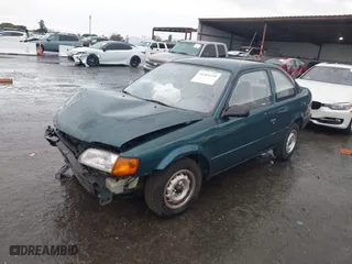 1996 Toyota Tercel DX with VIN JT2AC52L9T0127262, listed as a IAAI auction lot 41504210 with 135,732 mi miles. Bid and sale history available at carsss.com. Image 2.