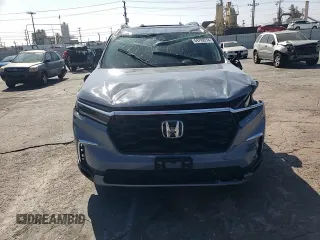 2023 Honda Pilot Touring with VIN 5FNYG2H7XPB011420, listed as a Copart auction lot 69799314 with 9,601 mi miles and Salvage Title. Bid and sale history available at DreamBid. Image 12.