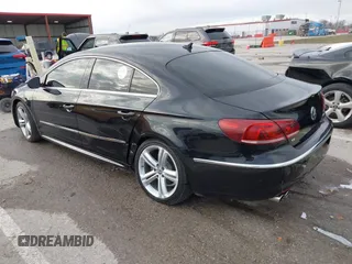 2014 Volkswagen CC R-Line with VIN WVWBN7ANXEE521055, listed as a IAAI auction lot 41197539 with 94,902 mi miles. Bid and sale history available at carsss.com. Image 3.