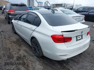 2018 BMW 3 Series 320i xDrive with VIN WBA8E5G52JNU46803, listed as a IAAI auction lot 41869625 with 67,057 mi miles. Bid and sale history available at carsss.com. Image 3.