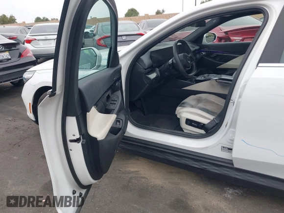 2024 BMW i5 eDrive40 with VIN WBY33FK03RCR99079, listed as a IAAI auction lot 42028540 with 28,827 mi miles and . Bid and sale history available at DreamBid. Image 5.