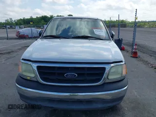2002 Ford F-150 XL with VIN 1FTRX17242NA69697, listed as a IAAI auction lot 42038258 with 207,008 mi miles. Bid and sale history available at carsss.com. Image 6.