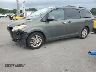 2012 Toyota Sienna XLE AAS with VIN 5TDYK3DC3CS216199, listed as a Copart auction lot 62774935 with 201,297 mi miles and Salvage title. Bid and sale history available at DreamBid. Image 1.