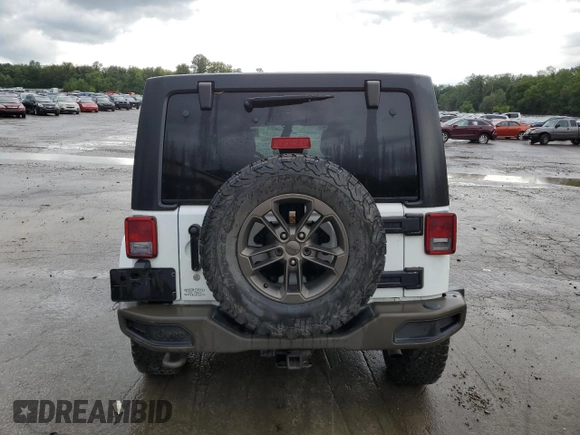2016 Jeep Wrangler Unlimited Sahara with VIN 1C4BJWEGXGL245041, listed as a Copart auction lot 88099245 with 134,768 mi miles and Salvage title. Bid and sale history available at DreamBid. Image 6.