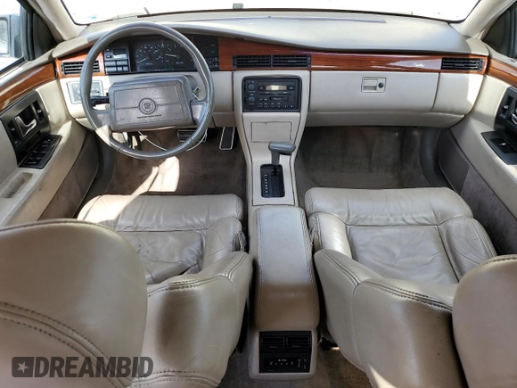 1992 Cadillac Seville z VIN 1G6KS53B0NU837105, wystawiony jako Copart lot #55865205 z przebiegiem 94 740 mil mil oraz Szkody całkowita. Historia ofert i sprzedaży dostępna na DreamBid. Obrazek 8.