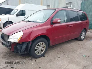 2012 Kia Sedona LX with VIN KNDMG4C75C6422392, listed as a IAAI auction lot 41235462 with 211,653 mi miles. Bid and sale history available at carsss.com. Image 2.