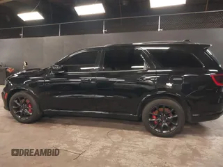2023 Dodge Durango R/T Plus with VIN 1C4SDJCT8PC571642, listed as a IAAI auction lot 42093743 with 33,631 mi miles and . Bid and sale history available at DreamBid. Image 14.