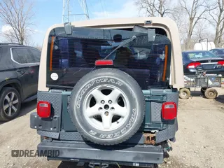 2002 Jeep Wrangler Sport with VIN 1J4FA49S62P743771, listed as a IAAI auction lot 41791205 with 186,622 mi miles. Bid and sale history available at carsss.com. Image 17.