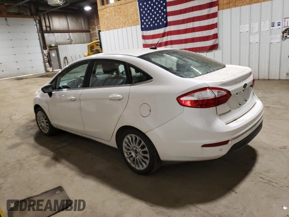 2016 Ford Fiesta Titanium z VIN 3FADP4CJ0GM167738, wystawiony jako Copart lot #57875245 z przebiegiem 159 230 mil mil oraz Czysty tytuł • Clean title. Historia ofert i sprzedaży dostępna na DreamBid. Obrazek 2.
