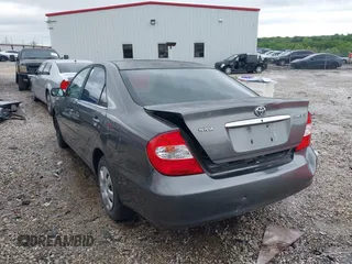 2004 Toyota Camry LE with VIN 4T1BE32K64U868802, listed as a IAAI auction lot 42141061 with 254,215 mi miles. Bid and sale history available at carsss.com. Image 3.